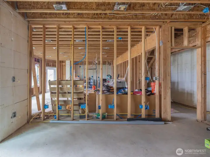 The great room looking to the N with 3rd BR with ensuite bath. Slider to outside also.