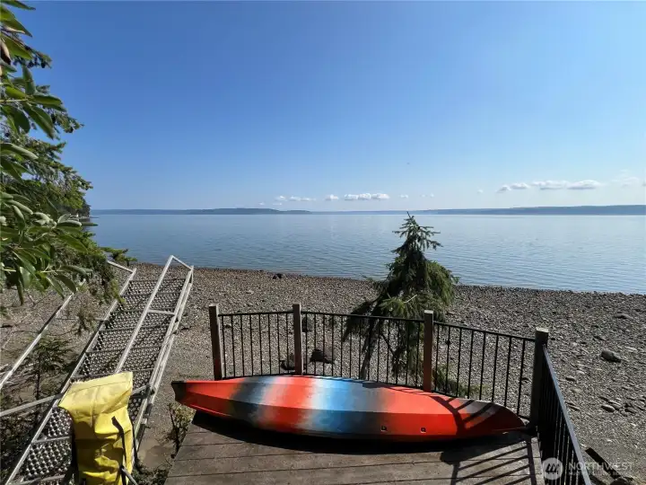Deck above beach for sitting and keeping water toys.