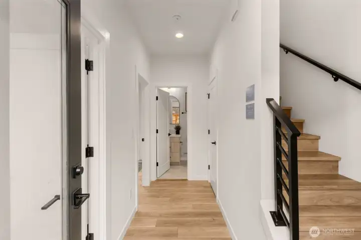 Step inside! Whether you’re coming home from work or welcoming friends this bright entryway welcomes you with warm wood flooring and clean lines.