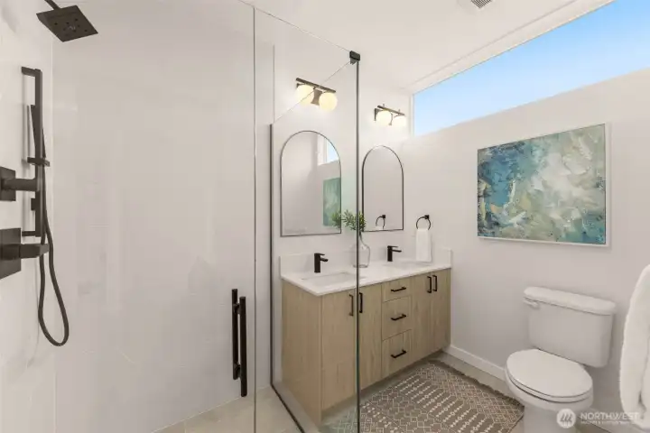 A primary bath that checks every box: dual vanity, walk-in glass shower, bold matte fixtures, and perfect natural light.