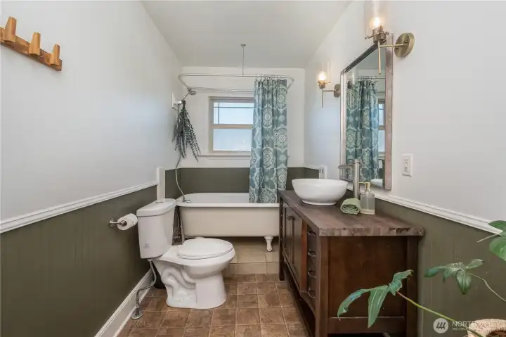 Clawfoot tub and thoughtful finishes in Bathroom #1