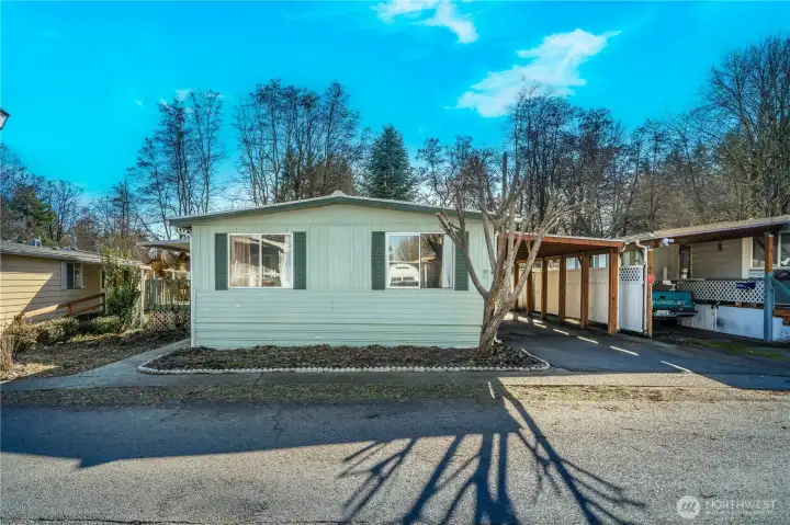 Affordable 3-bedroom home in a welcoming 55+ community offering covered parking, outdoor space, and the opportunity to create your own comfortable retreat.