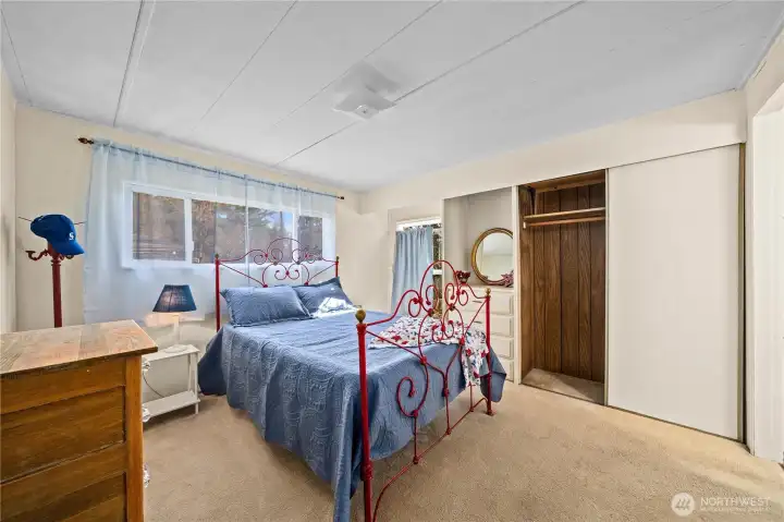 Spacious primary bedroom with room for full furnishings and a comfortable retreat feel.