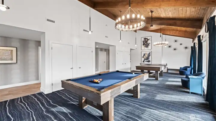 Recreation space featuring billiards/ping pong and comfortable seating for games and social time.