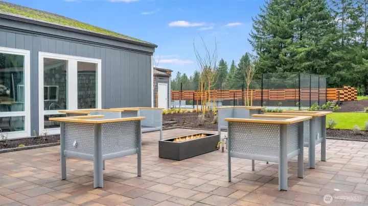 Inviting outdoor patio featuring a gas firepit and seating area—perfect for evening gatherings and relaxed conversation.