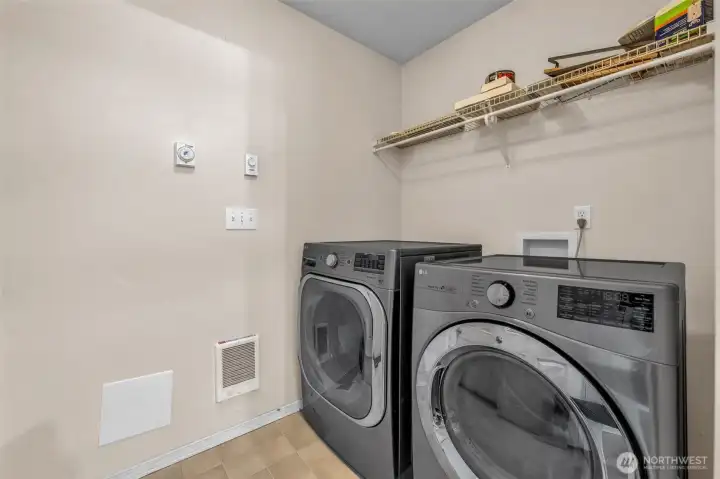 Main floor laundry between home and garage.