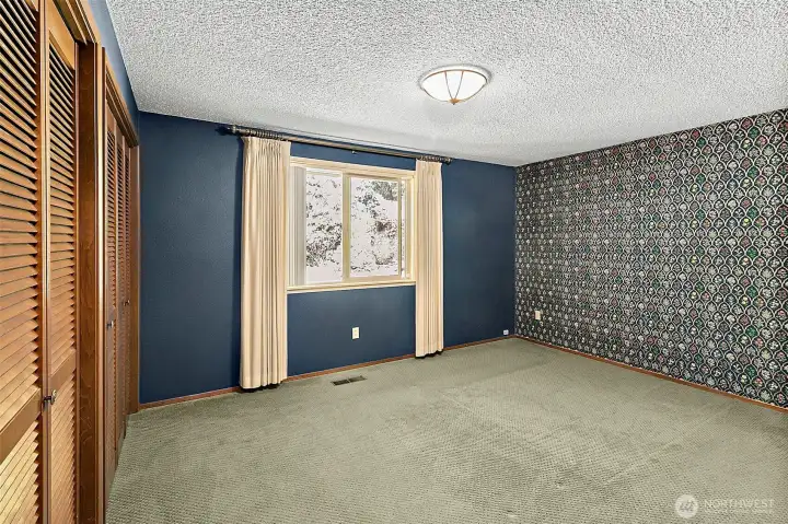 A spacious primary bedroom to unwind at the end of the day.