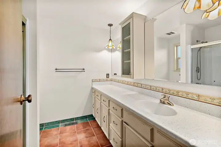 Enjoy the comfort of a heated-floor bathroom.