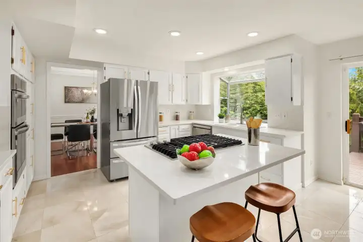 The kitchen has been refreshed with painted cabinets and new countertops. Pull up a stool and share your dales for the day. Ceramic tiles are a practical choice for easy cleaning