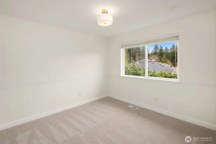 There are two secondary bedrooms on the upper floor. New carpets throughout all the bedrooms