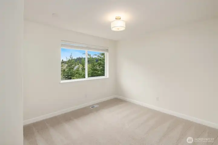 There are two secondary bedrooms on the upper floor. New carpets throughout all the bedrooms