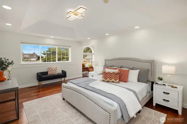 The primary suite is a surprise and delight. Gleaming Brazilian cherry floors, room for a king size bed, and vaulted ceilings add a real sense of grandeur