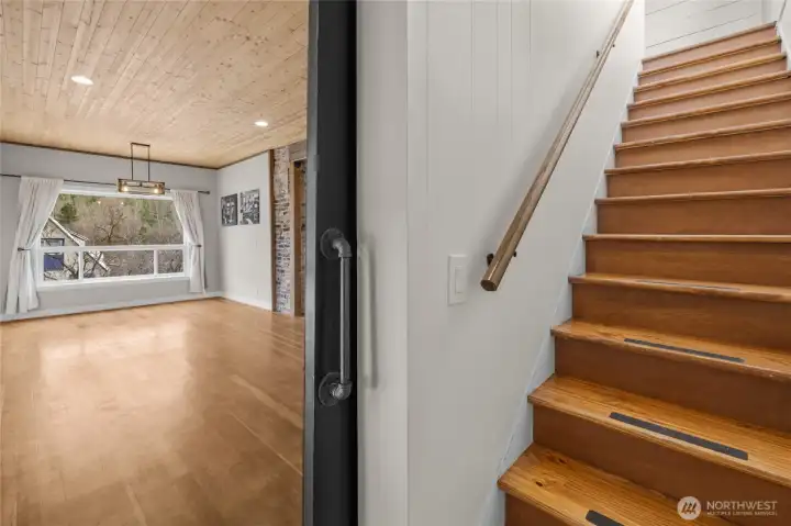 View from the primary suite barndoor headed upstairs