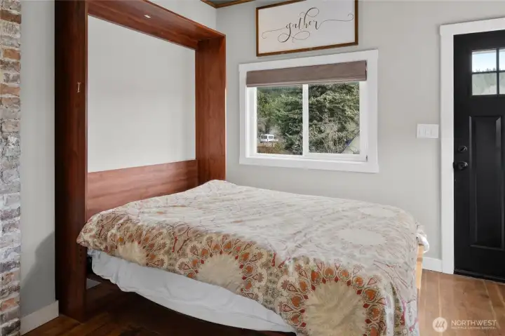 In the main entry is a custom hide a way bed, perfect for extra guest.