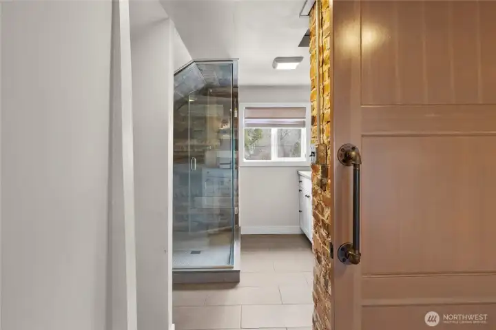 Original brick as you enter into the restroom creates such a delightful character in this area.