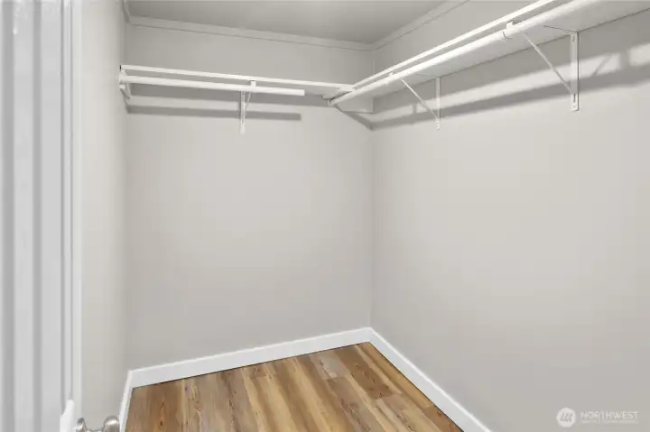 Large walk in closet for the lower primary bedroom.