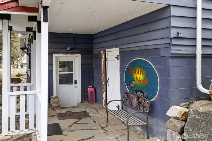 View of the covered lower entrance to the home.