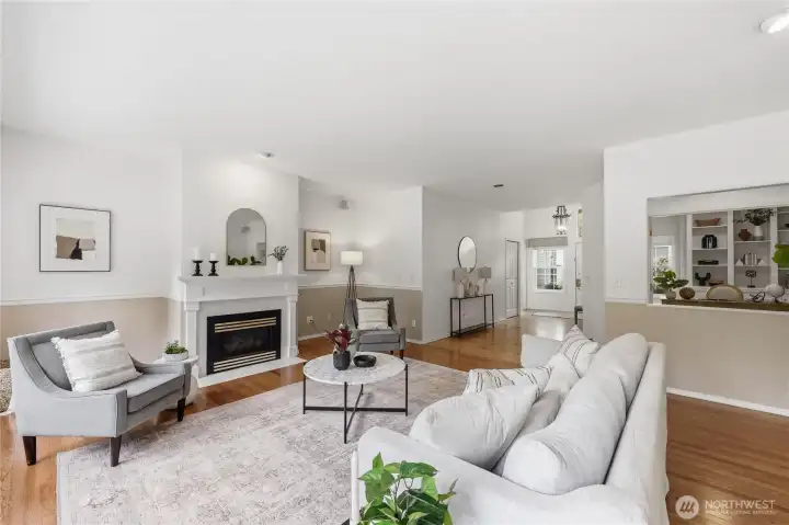 Living room with front door and window in the background