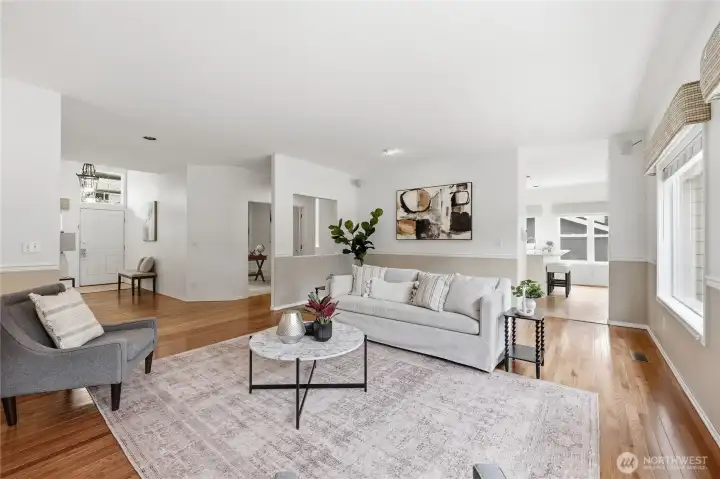 Spacious living room: entry to dining and kitchen on right, hallway to office on left