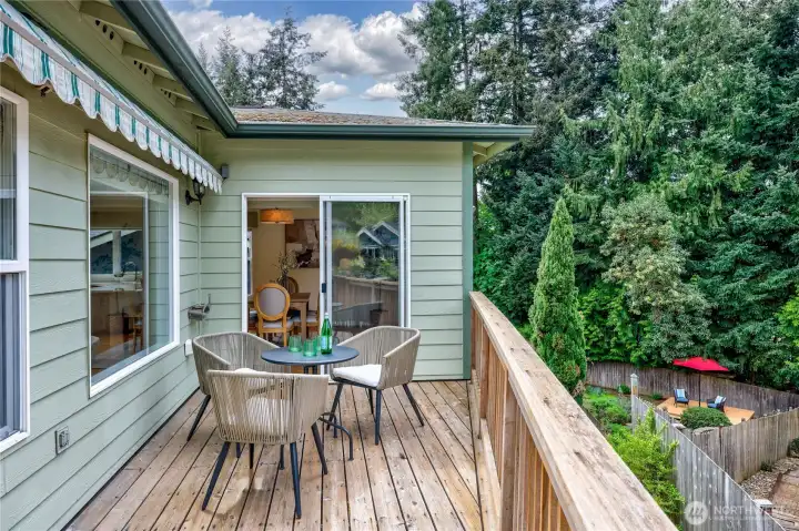 Notice the electric powered awning on left, and the deck below with red umbrella,on the right