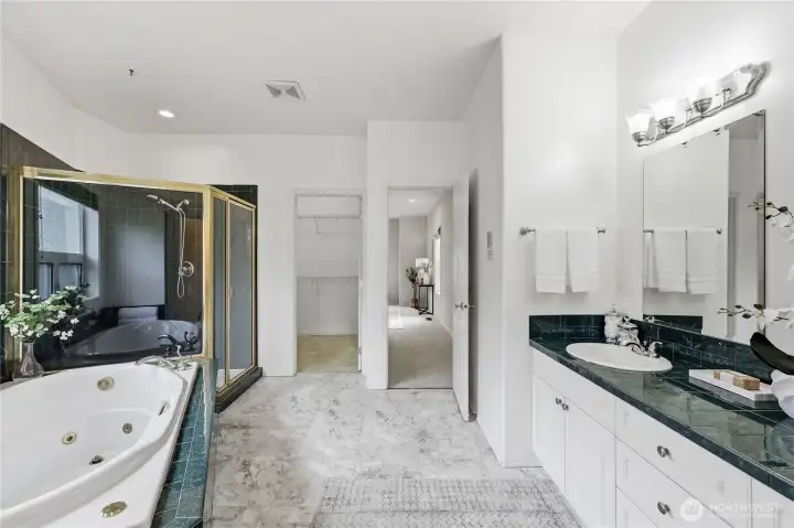 Ensuite with roomy shower, jetted bathtub and double sinks