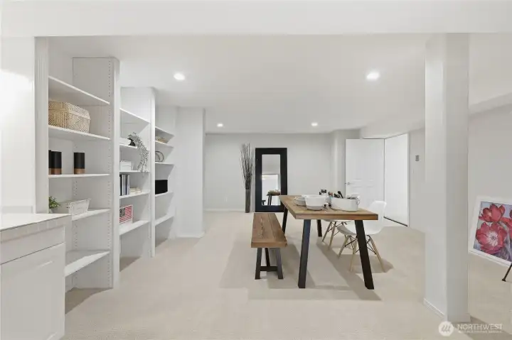 Spacious arts and crafts room with built in shelves