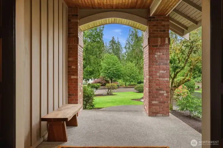 A covered double-door entry welcomes you into a foyer.