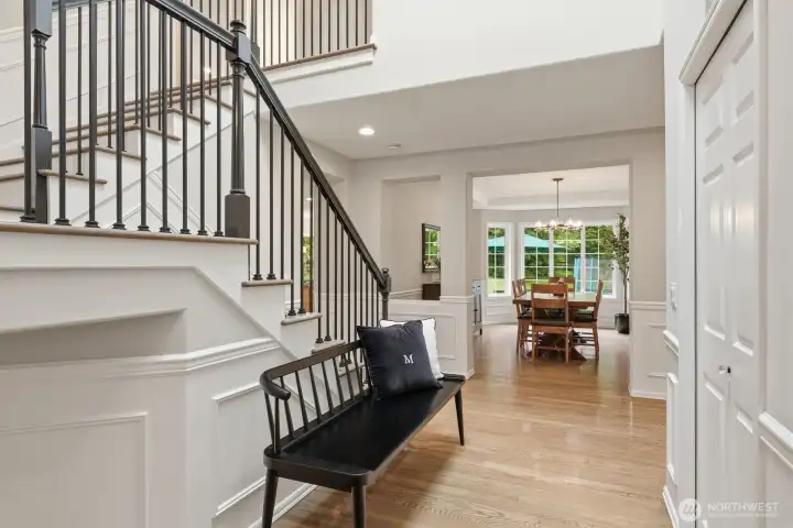 Gracefully turned staircase with newly updated iron railings and hardwood treads.