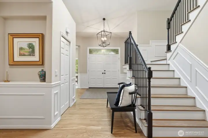Gacefully turned staircase with newly updated iron railings and hardwood treads.