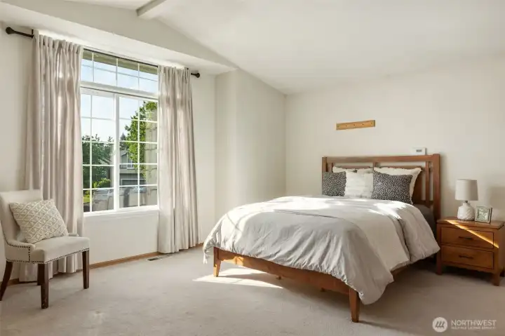 Vaulted ceilings and natural light fill the space