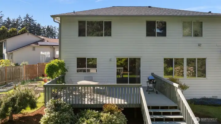 Back deck leads you to this beautifully maintained yard with plenty of space to play!