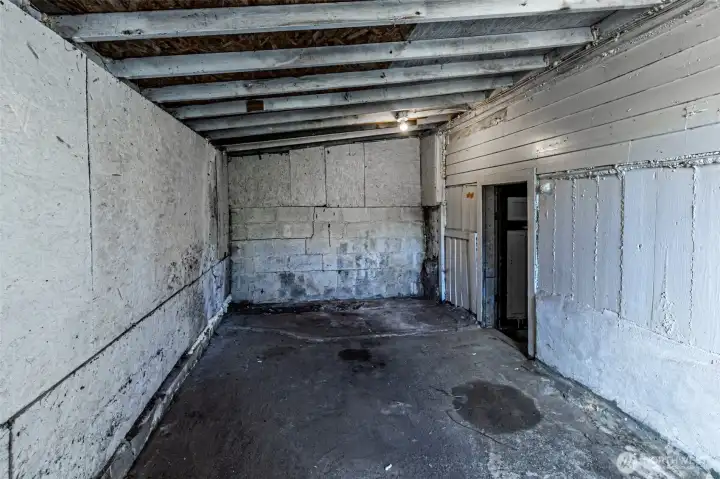 Unfinished Room connected to downstairs utility room  electricity and exterior door