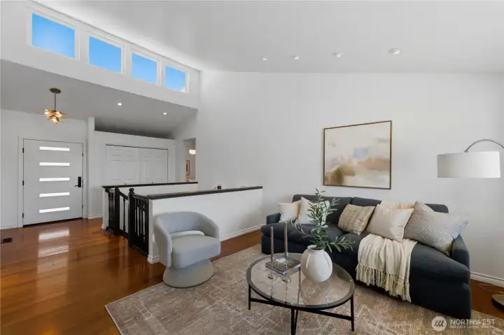 Step inside to find gleaming cherry floors, soaring ceilings, and clerestory windows that fill the home with natural light. Step inside to find gleaming cherry floors, soaring ceilings, and clerestory windows that fill the home with natural light.