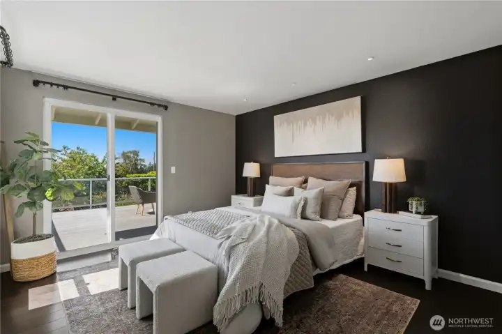 The primary suite features soothing designer colors and direct deck access—perfect for enjoying a quiet morning coffee. The primary suite features soothing designer colors and direct deck access—perfect for enjoying a quiet morning coffee.