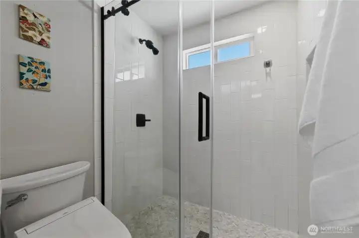 It also offers a walk-in shower with tile surround and a Toto bidet. It also offers a walk-in shower with tile surround and a Toto bidet.