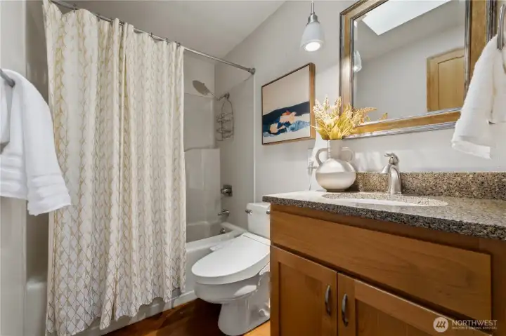 A full guest bath with a Toto bidet completes the main floor. A full guest bath with a Toto bidet completes the main floor.