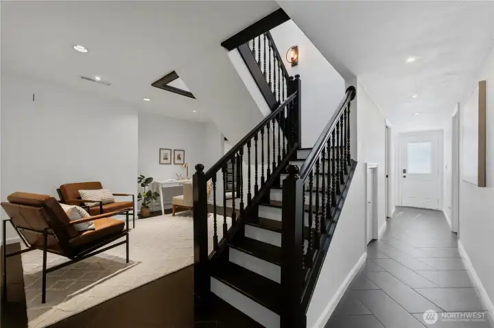 At the bottom of the stairs, you'll find a flexible space perfect for an office, craft room, or study area. High ceilings continue throughout the lower level. Don't overlook the secure vault! At the bottom of the stairs, you'll find a flexible space perfect for an office, craft room, or study area. High ceilings continue throughout the lower level. Don't overlook the secure vault!