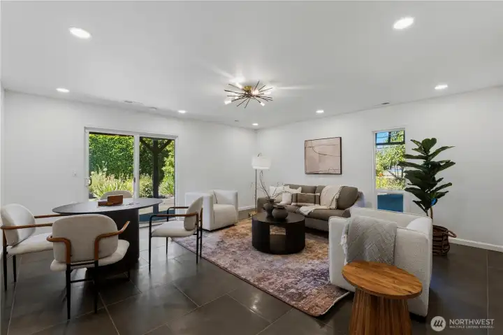 You'll also find a spacious media room with plenty of room to spread out for games, movies, and entertaining. Sliders lead to a covered patio. You'll also find a spacious media room with plenty of room to spread out for games, movies, and entertaining. Sliders lead to a covered patio.