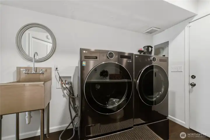 The laundry room houses the LG washer and dryer that stay with the home, along with the new Trane furnace, heat pump, and tankless water heater. The laundry room houses the LG washer and dryer that stay with the home, along with the new Trane furnace, heat pump, and tankless water heater.