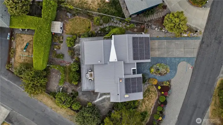 An 80-year steel roof provides long-term peace of mind, while RV parking and beautiful landscaping complete the exterior. An 80-year steel roof provides long-term peace of mind, while RV parking and beautiful landscaping complete the exterior.