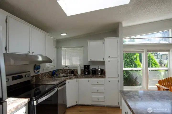 Kitchen with windows and skylight providing plenty of natural light