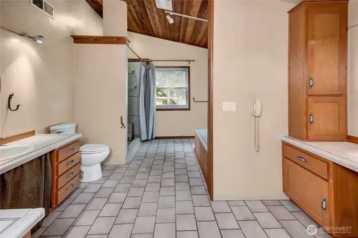 Primary bathroom with 2 vanities and separate storage with counter space. Primary bathroom with 2 vanities and separate storage with counter space.