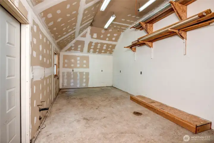 Semi-finished room behind the garage has access to main home. Semi-finished room behind the garage has access to main home.