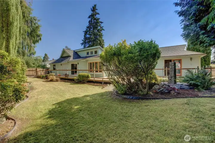 Backyard deck runs the length of the home with access through two sliding glass doors. Backyard deck runs the length of the home with access through two sliding glass doors.