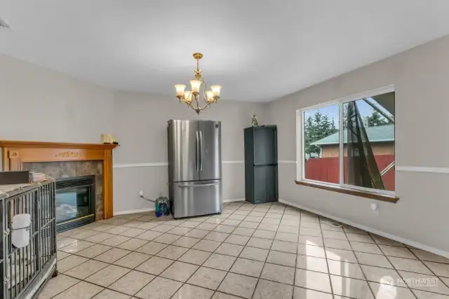 The family room has a fireplace and access to the patio and fully fenced backyard, for convenient indoor-outdoor living.