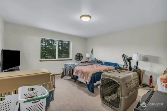 Spacious primary bedroom with 5-piece bath and walk-in closet.