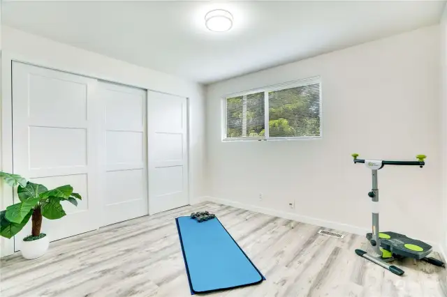 This third bedroom has a generous, extended closet, plank floors and newer paint. This would be a great workout room, media room or traditional guest bedroom!