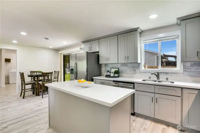 Updated AND functional - what more could you want? Truly a kitchen fit for any chef with plenty of counter space, cabinet storage and updated lighting.