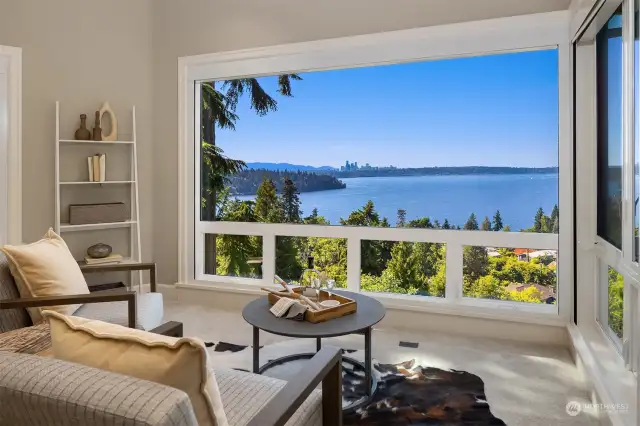 Spacious primary room with floor to ceiling windows to soak up the view.