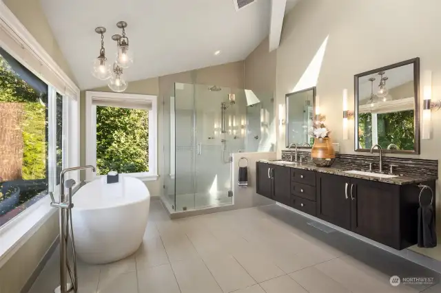 Double vanity, shower, and luxury tab in the primary bathroom.
